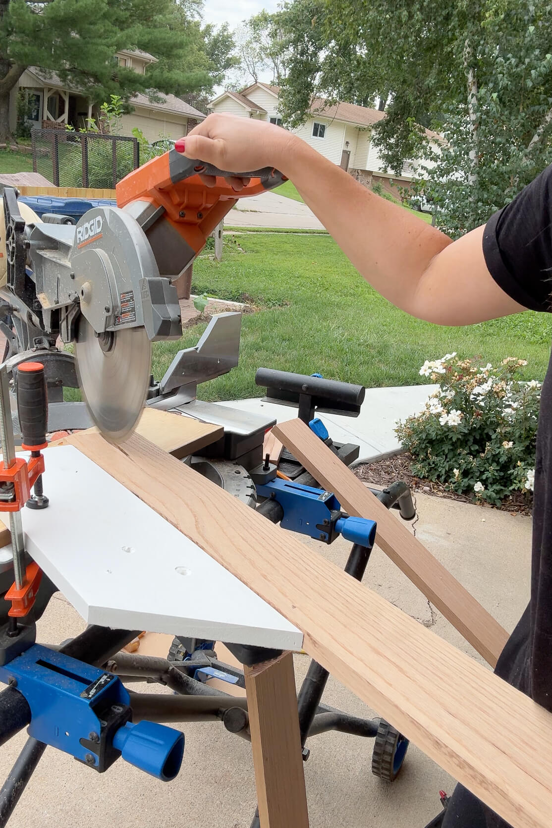 Using a DIY jig to cut a wide angle on a miter saw.